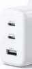 A close-up view of a white Ugreen wall charger with three ports. Náhľad obrázku produktu
