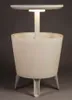 A white illuminated bar table with a central support and a round top, resting on three legs, against a plain gray background. Anteprima dell’immagine prodotto