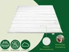 A white duvet is laid out on a light yellow background, with a dark green curved shape on the right side. There are icons and text boxes highlighting product features. Náhľad obrázku produktu