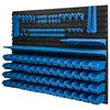 A black pegboard wall system with various blue storage bins and tool holders attached. Náhled obrázku produktu