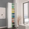 A white storage cabinet filled with colorful binders in an office setting. Voir les images du produit