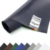 A rolled-up piece of dark blue PVC material with a textured surface, displayed on a white background. A label with product information is attached to the material. Below the main product image, a row of smaller swatches in various colors is visible. Anteprima dell’immagine prodotto