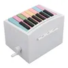 A white music box designed to look like a piano with colorful keys. Produktbild-Vorschau