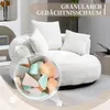A close-up view of a beige bean bag chair with pillows, featuring a circular inset showing colorful foam pieces. Produktbild-Vorschau