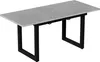 A rectangular dining table with a gray stone-like surface and black metal legs, shown from a slightly elevated angle against a white background. Náhľad obrázku produktu