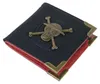 A black wallet with a bronze skull and crossbones emblem and bronze corner protectors, shown against a white background. Produktbild-Vorschau