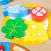 A close-up view of wooden and felt toy food items arranged on a plate. Podgląd zdjęcia produktu