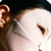 A close-up of a person's face wearing a sheet mask. Náhľad obrázku produktu