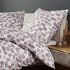 A close-up view of bedding with a polka dot pattern. Produktbild-Vorschau