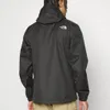 A person wearing a black jacket. Produktbild-Vorschau