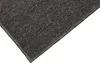 A close-up view of the corner of a dark gray carpet. Anteprima dell’immagine prodotto