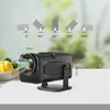 A black projector is shown on a table with a bowl of vegetables in the background. Diagrams illustrating different projection angles are displayed above the projector. Náhľad obrázku produktu