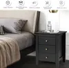 A bedside table next to a bed in a bedroom. Podgląd zdjęcia produktu