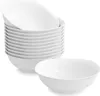 A stack of white ceramic bowls and one bowl in the foreground. Produktbild-Vorschau