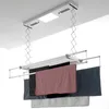 A ceiling-mounted automatic clothes drying rack with towels hanging on it. Produktbild-Vorschau