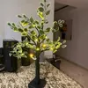 A decorative artificial tree with LED lights sits on a speckled countertop. Produktbild-Vorschau
