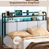 A bed frame with a headboard featuring storage and LED lighting, displaying decorative items and electronics. Náhled obrázku produktu