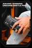 A person is holding a black smartphone case with a built-in stand and ring. Produktbild-Vorschau