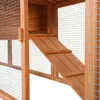 A close-up view of a wooden rabbit hutch, showing the ramp and mesh wire. Produktbild-Vorschau