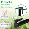 Close-up of black plastic garden accessories on a blurred background of green grass with water droplets. Voir les images du produit
