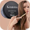 A woman is shown combing her long brown hair, with a product container for Fanola Keraterm Mask in the background. Náhled obrázku produktu
