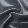 A close-up view of draped gray fabric, showing its texture and folds. Produktbild-Vorschau