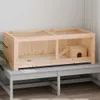 A wooden hamster cage with a small house and ramp inside, placed on a grey slatted bench against a white wall. Produktbild-Vorschau
