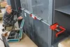 A man is using a clamp tool on a large panel. Produktbild-Vorschau