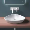 A modern bathroom sink with a wall-mounted faucet. Produktbild-Vorschau