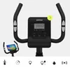 Close-up view of the handlebars and console of a black stationary bicycle, with icons at the bottom representing fitness features. Produktbild-Vorschau