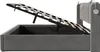 A side view of a gray upholstered bed frame with the mattress support lifted to reveal storage space underneath. Náhľad obrázku produktu