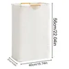 A white laundry basket with wooden handles is shown against a white background, with dimensions indicated by measurement lines and text. Produktbild-Vorschau