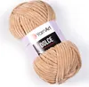 A ball of beige yarn with a label. Náhľad obrázku produktu