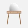 A wooden dressing table with a rounded mirror and two drawers with rattan fronts, set against a white background. Produktbild-Vorschau