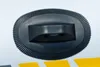 A close-up of a black handle with a textured base on a white surface with yellow and gray stripes. Anteprima dell’immagine prodotto