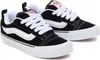A pair of black Vans sneakers with white laces and a white side stripe, shown from a slightly elevated side angle on a white background. Voir les images du produit