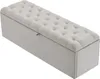 A light gray upholstered storage bench with button tufting on the lid. Voir les images du produit