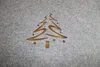 A Christmas tree design is cut out of a grey felt material, revealing a wooden surface underneath. Produktbild-Vorschau
