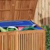 Close-up view of the inside of a wooden garden storage box, showing gardening tools and a blue cover. Produktbild-Vorschau