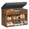 A shoe bench with storage and a cushioned top, open to reveal shoes and headphones inside. Produktbild-Vorschau
