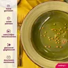 A close-up view of green and light green ceramic plates with decorative orange dots, set against a yellow fabric background. A golden fork is placed between the plates. Náhled obrázku produktu