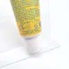 A close-up of a tube of sunscreen with text and symbols visible. Produktbild-Vorschau