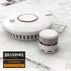 Two smoke detectors are placed on top of architectural blueprints. Produktbild-Vorschau