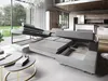 A sectional sofa with extended sleeping and storage features in a modern living room setting. Podgląd zdjęcia produktu
