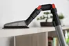 A vacuum cleaner attachment is shown cleaning the top surface of a shelf. Anteprima dell’immagine prodotto