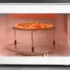 A pizza is being heated in a microwave on a rack. Anteprima dell’immagine prodotto