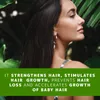 A woman with long dark hair is shown from the side, with lush green foliage in the background. A green overlay at the bottom of the image contains text describing product benefits. Produktbild-Vorschau