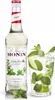 A bottle of Monin Mojito Mint syrup next to a glass of mojito cocktail. Podgląd zdjęcia produktu