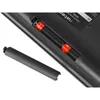 A close-up view of the battery compartment of a wireless keyboard, showing two AA batteries inserted and the battery cover removed. Náhled obrázku produktu