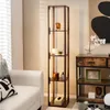 A living room scene with a floor lamp shelf and a sofa. Náhľad obrázku produktu